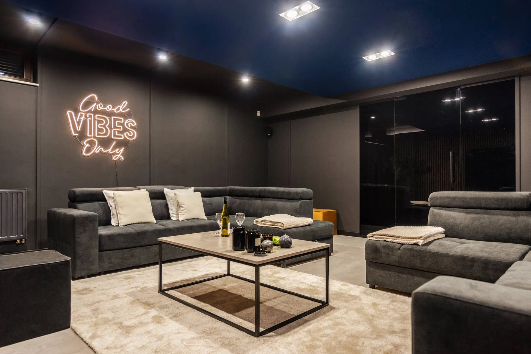 Cinema lounge with an 80-inch screen at Villa Wola